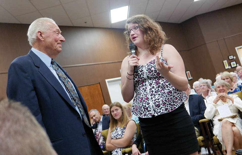 Photo of Bob and Dianne's granddaugher Erin giving comments