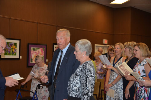 Photo of Bob, Dianne, and children singing