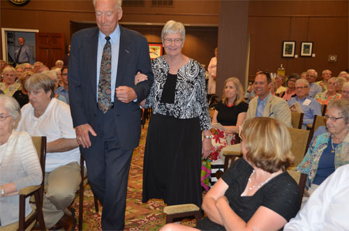 Photo of Bob and Dianne walking down the aisle