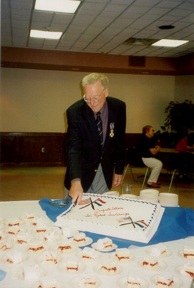 Robert cutting cake photo