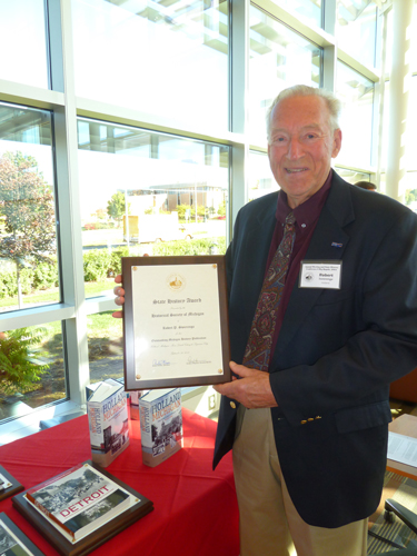 Photo of Robert Swierenga holding plaque for Book of the Year