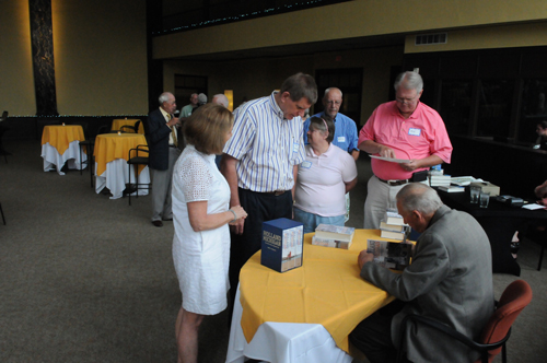 Photo of Robert Swierenga signing books